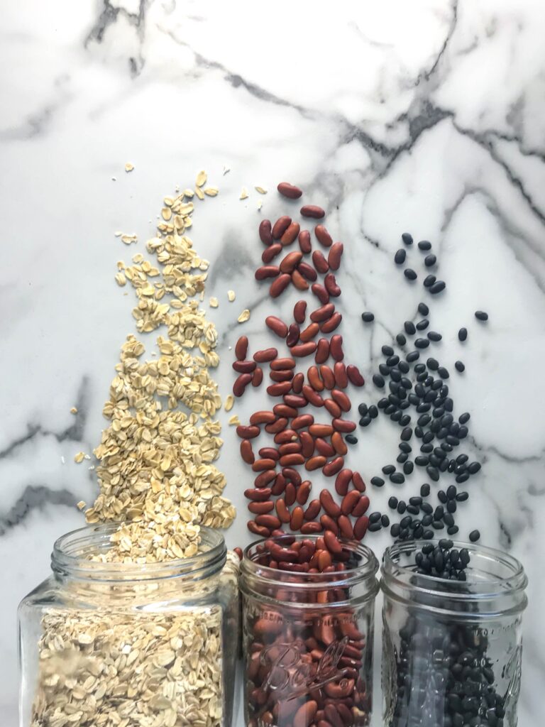 oatmeal and dry beans spilling out of jars