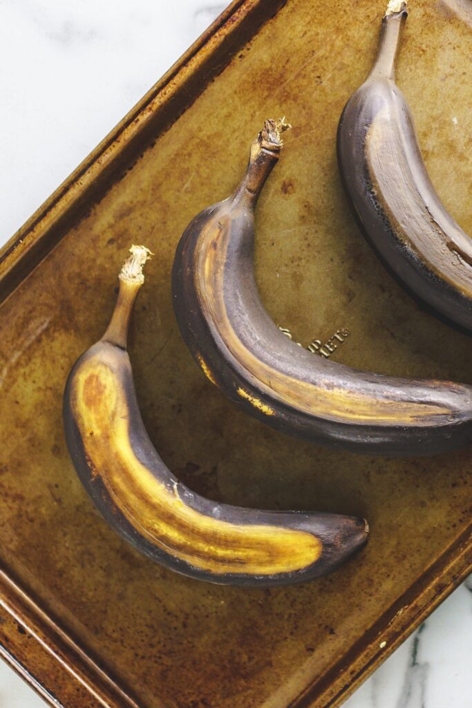 ripe bananas on baking sheet