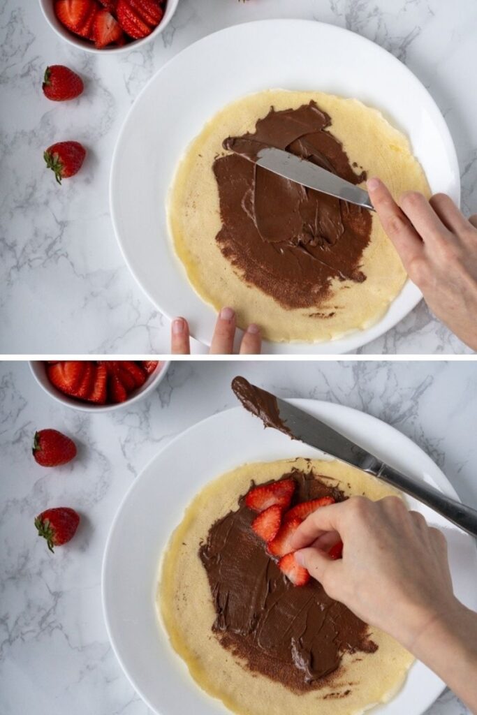 adding Nutella and strawberries to crepe