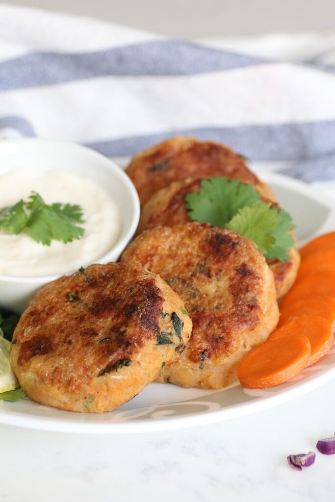 tuna cakes on plate with dipping sauce