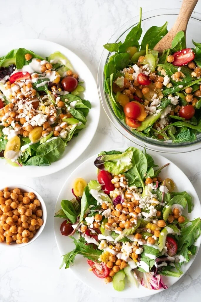 bowls and plates with salad