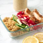 rectangular food container with quinoa, chicken and vegetables