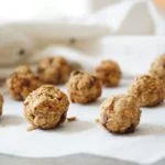 Apple Cinnamon Granola Clusters on parchment paper