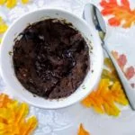 white cup containing chocolate cake