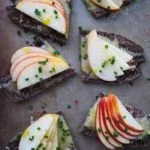 slices of toast topped with apple slices and melted cheddar cheese