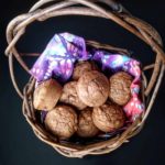 basket filled with carrot raisin muffins