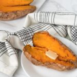 two sliced sweet potatoes on plates