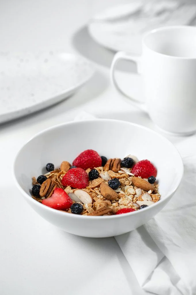 bowl of oats topped with berries
