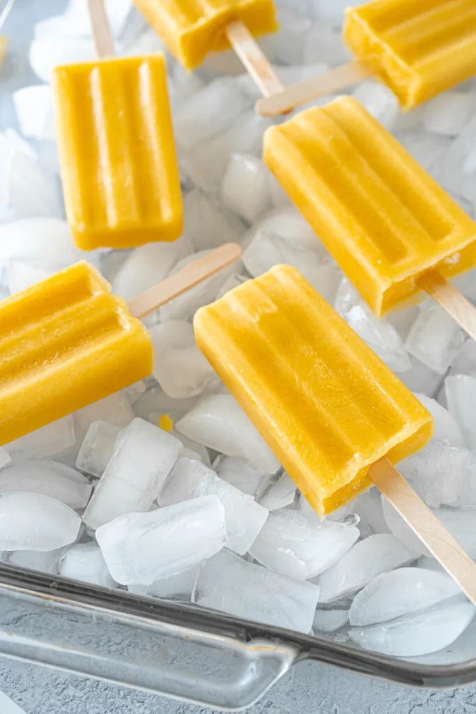 popsicles in tray full of ice