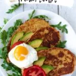 plate with three slices of French toast topped with fried egg