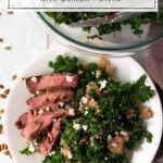 white plate with kale salad and sliced steak