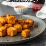 breaded tofu bites on a gray plate