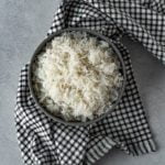 bowl of white rice on a checkered napkin