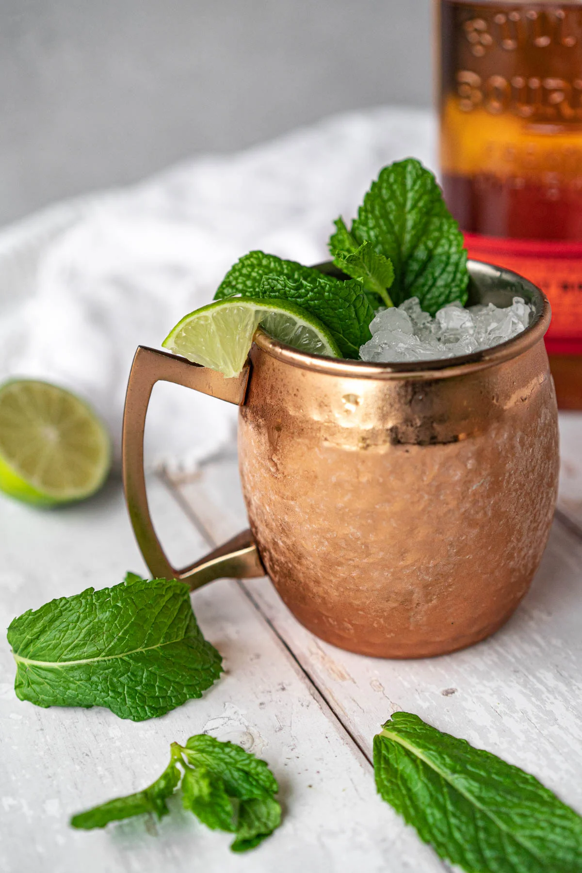 frosted copper mug garnished with lime and mint