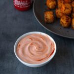 bowl of creamy dipping sauce with sriracha